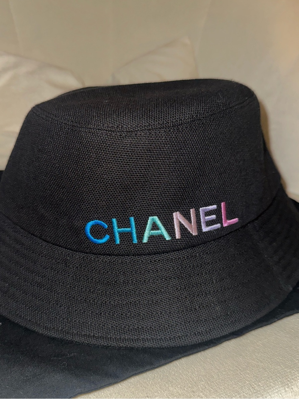 CHANEL Black Bucket Hat with White Logo Tag